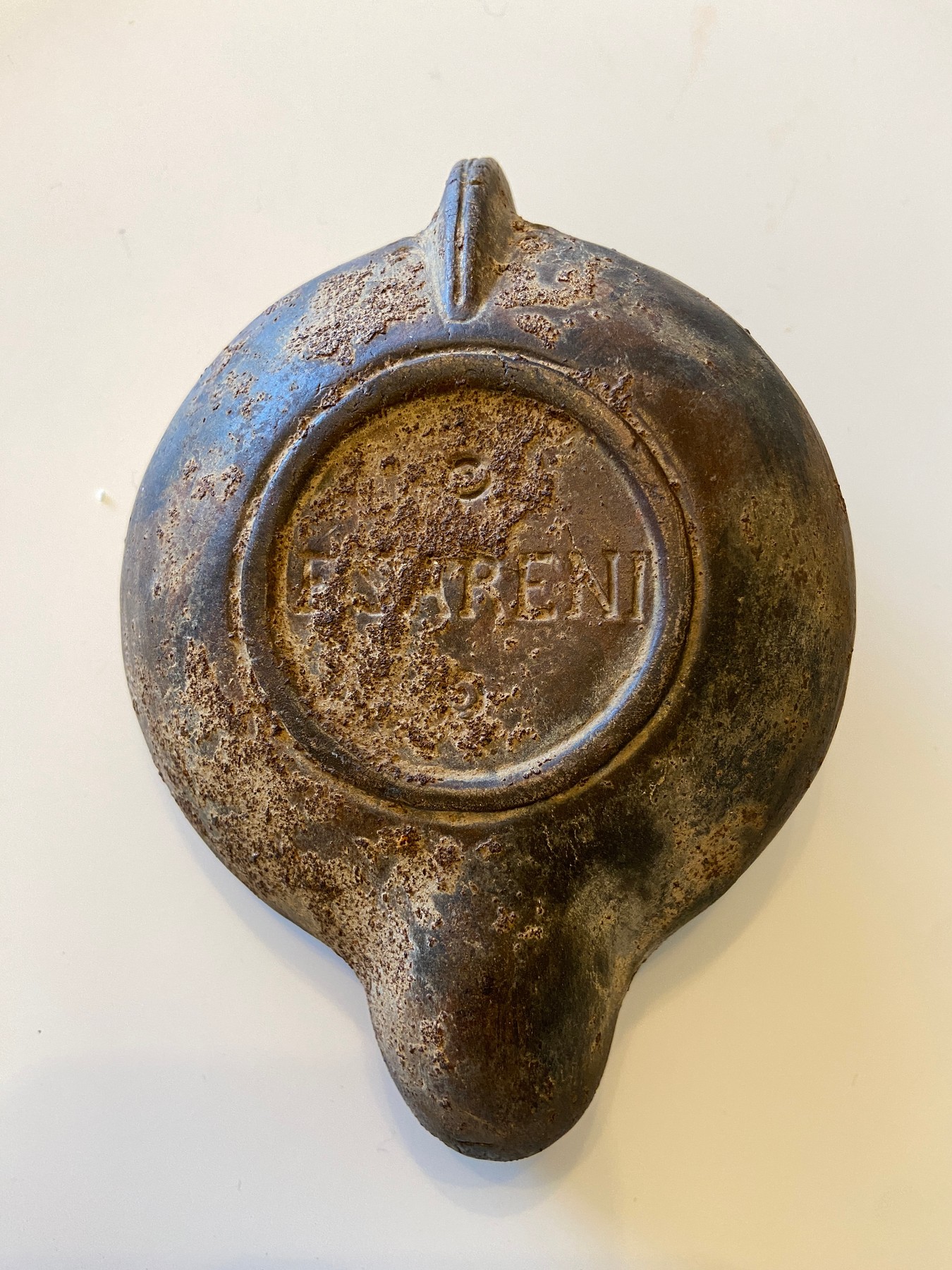 Underside of Lamp 1 with a raised mark inside a circular base ring