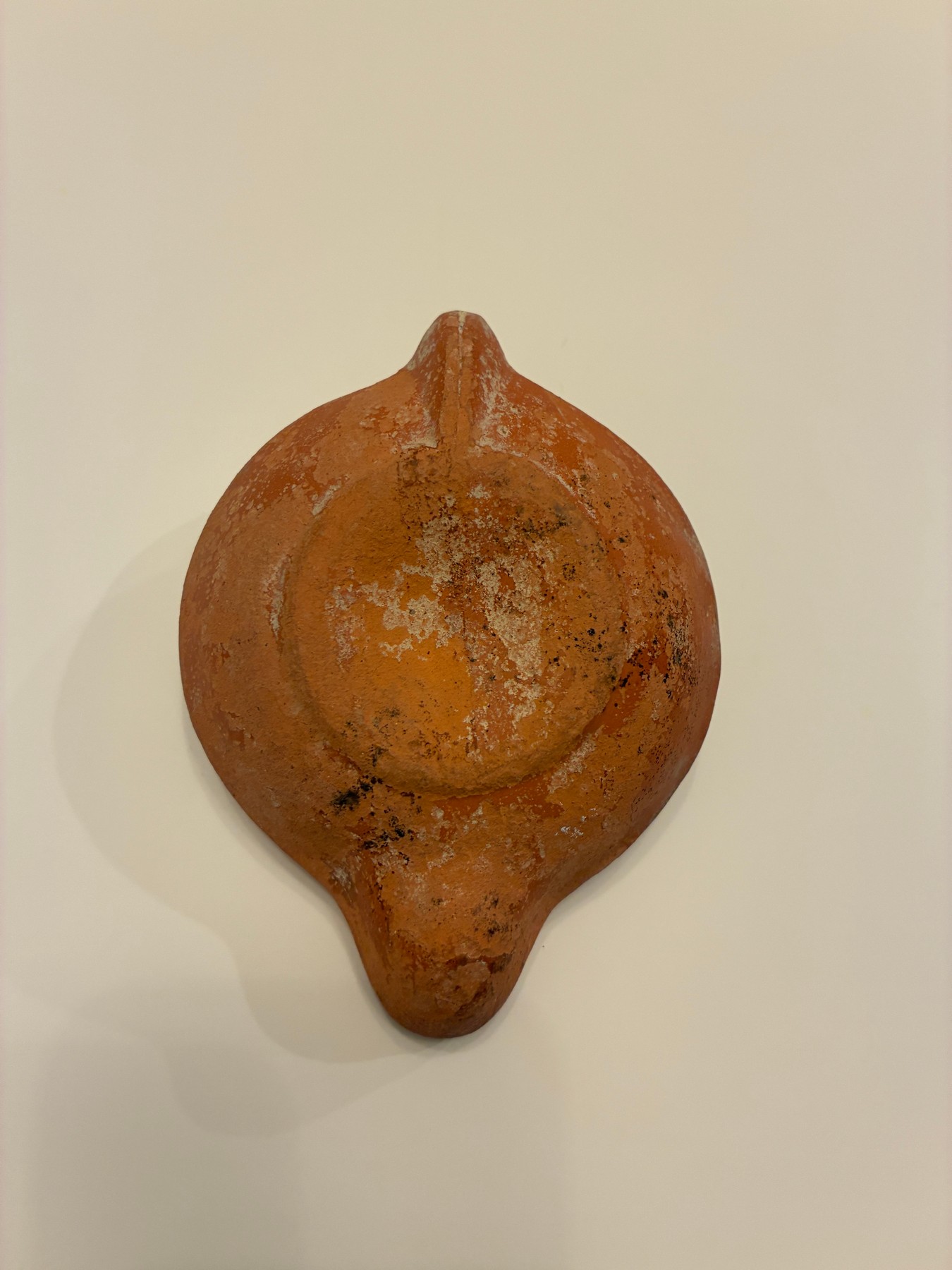 Roman lamp with a religious relief, back view